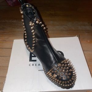 Black boots with gold spikes